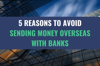 An image of the sky amidst tall skyscrapers with the title - 5 Reasons To Avoid Sending Money Overseas With Banks