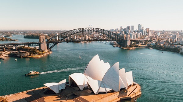 An image of the Sydney opera house in Australia near body of water daytime photo