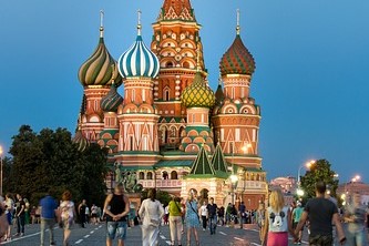 An image of Moscow St Basil'S Cathedral with people walking by in the front