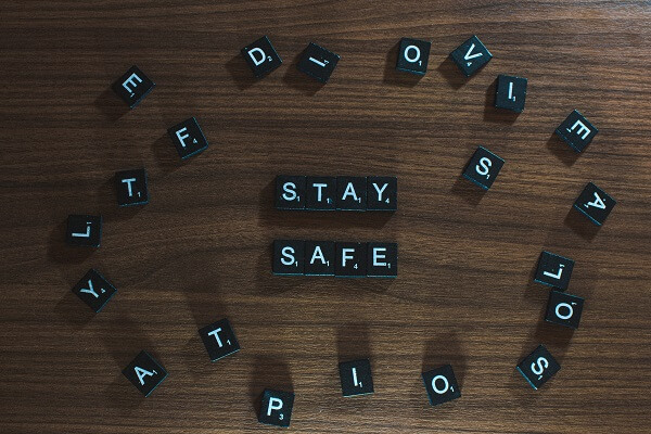 Alphabet tiles arranged to say the words Stay Safe