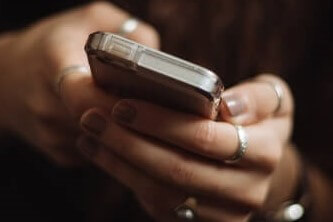 A person holding a smartphone in their hand