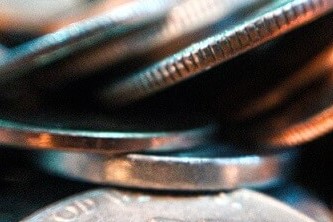 Round silver and gold coins in a photo