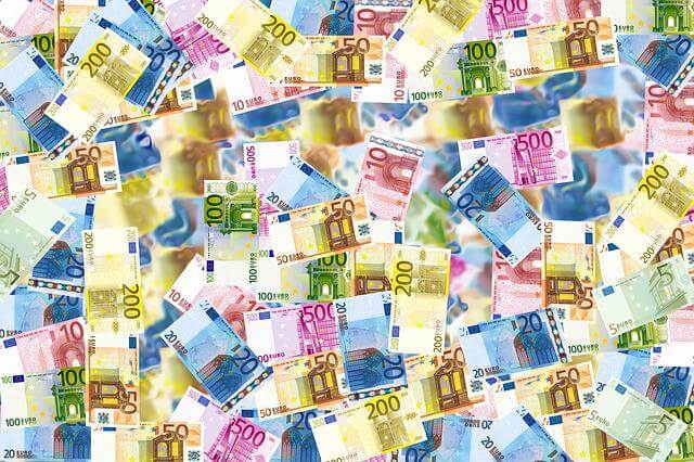 An assortment of various Euro denomination bills stacked together