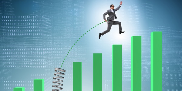 An image of a person jumping through increasingly high bars on a graph