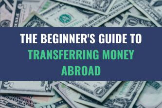 A pile of US Dollar currency bills with the title - The Beginner's Guide to Transferring Money Abroad