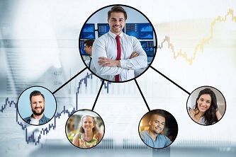 An image of a hierarchy of individuals with foreign exchange graphs in the background