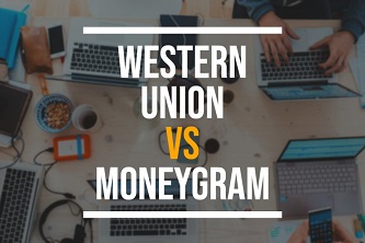Western Union vs MoneyGram printed on a background with laptops and phones on a table