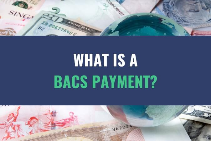 An image of an assortment of currency bills with the title - What Is A BACS Payment?