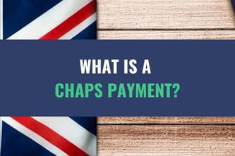 An image of a folded UK flag on a table with the title - What Is A CHAPS Payment?